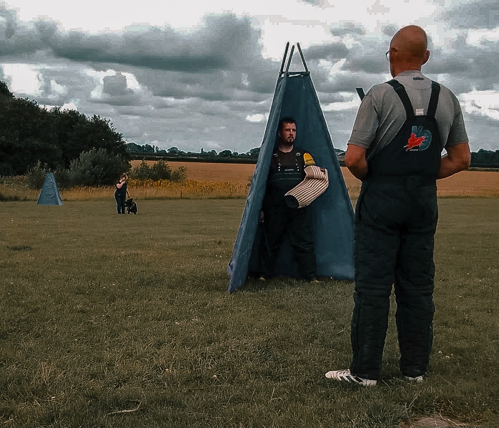 Working dog handler training with a Belgian Malinois outdoors